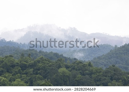 Beautiful cloud formations preceding the rain, covering Doi Luang Chiang Dao mountain in Chiang Dao district, Chiang Mai province
