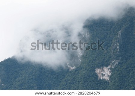 Beautiful cloud formations preceding the rain, covering Doi Luang Chiang Dao mountain in Chiang Dao district, Chiang Mai province
