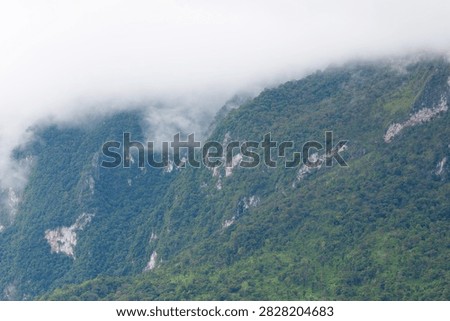 Beautiful cloud formations preceding the rain, covering Doi Luang Chiang Dao mountain in Chiang Dao district, Chiang Mai province
