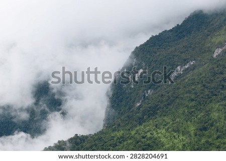 Beautiful cloud formations preceding the rain, covering Doi Luang Chiang Dao mountain in Chiang Dao district, Chiang Mai province
