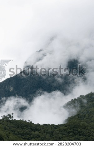 Beautiful cloud formations preceding the rain, covering Doi Luang Chiang Dao mountain in Chiang Dao district, Chiang Mai province
