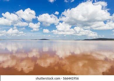 Beautiful Clouds In Blue Sky With Reflection In Calm Water In The Morning Lake. Nature Wallpaper