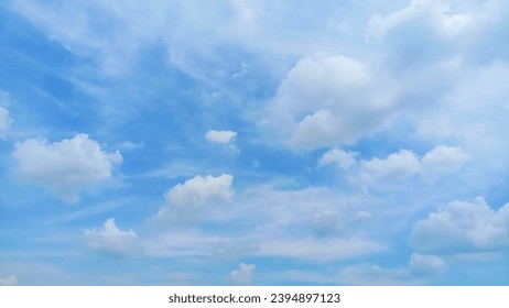 beautiful clouds in the sun calm blue background during sunny winter - Shutterstock ID 2394897123