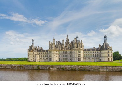 Beautiful Cloudscape And Blue Sky Over Chateau Chambord .
Castle With Very Distinctive French Renaissance Architecture