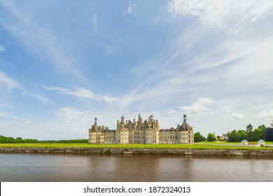 Beautiful Cloudscape And Blue Sky Over Chateau Chambord .
Castle With Very Distinctive French Renaissance Architecture