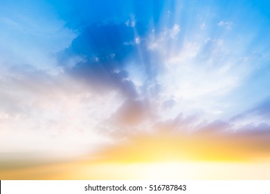 beautiful cloudy blue sky, morning sun rise with sunny bright shining golden light ray from dark cloud, new years background or heaven gate opening concept. - Shutterstock ID 516787843