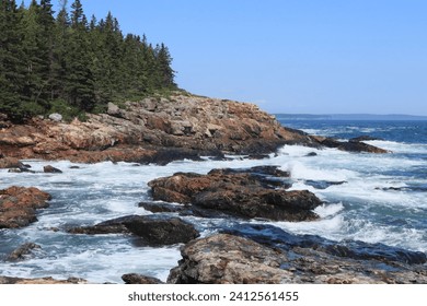 A beautiful coastal landscape with a rocky shoreline and ocean waves in Acadia National Park - Powered by Shutterstock