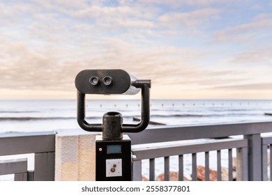 Beautiful Coastal View With Binoculars Highlighting the Serene Ocean Landscape at Sunset. - Powered by Shutterstock