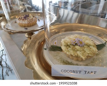 Beautiful Coconut Tart Decorated With Flowers With The Words 