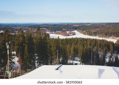Beautiful cold mountain view of ski resort, sunny winter day with slope, piste and ski lift