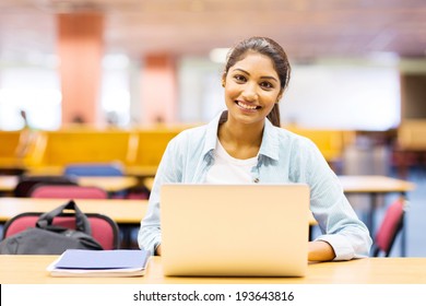 Beautiful College Girl Using Laptop In Lecture Hall