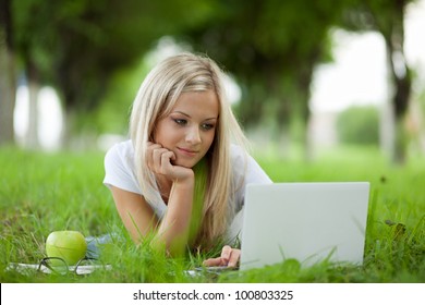 Beautiful College Student Relaxing In Park