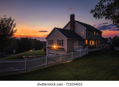 Beautiful colonial style house at sunset