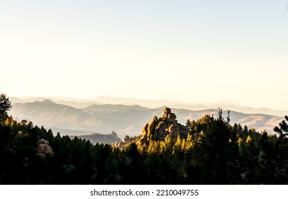 Beautiful Colorado landscape. Forest and rock formation at Devil's Head Lookout trail just before sunset