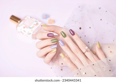 Beautiful colored nail polishes with shine and reflections,Fashionable spring summer nail design,large aperture blurred background