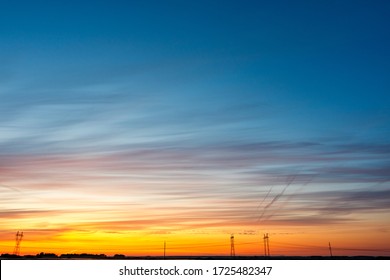 beautiful colored sky over the electric highway which is located on the horizon line. bright sky स्टॉक फ़ोटो