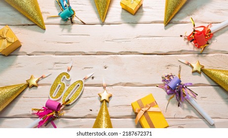 Beautiful colorful card on the background of white boards happy birthday in golden hues copy space. Beautiful ornaments and decorations of gold color festive background. Happy birthday number 60