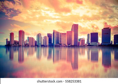 Beautiful colorful city of Miami Florida skyline and bay with dramatic clouds at sunset