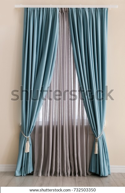 Beautiful colorful curtains in\
room