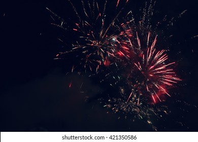 Beautiful colorful holiday fireworks in the night sky.