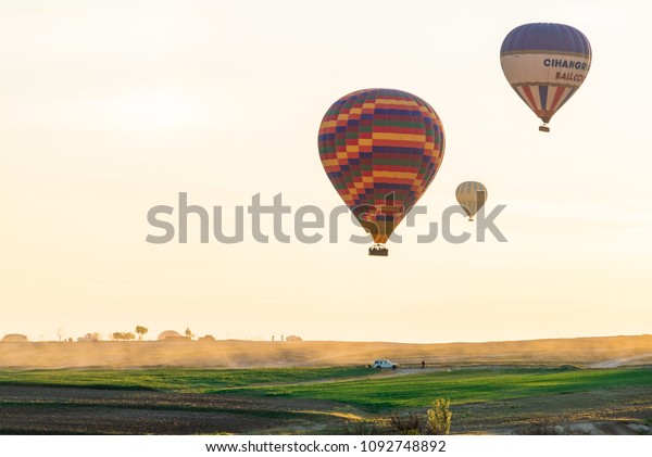 Beautiful colorful hot air balloons at\
Goreme,Cappadocia,Turkey.Morning time.Sun was rising.Hot air\
ballooning in Cappadocia.You should not miss this event Once a time\
in your life.1 may\
2018.