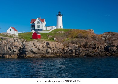 Beautiful Colorful Lighthouse Along Atlantic Ocean Coast In New England Marking Lighting Rocky Shore