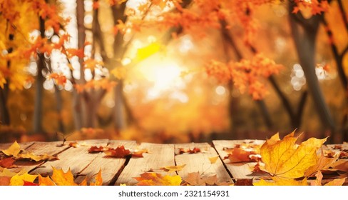 Beautiful colorful natural autumn background for presentation. Fallen dry orange leaves on wooden boards against the backdrop of a blurry autumn park. - Powered by Shutterstock