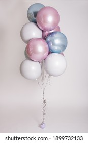 beautiful colorful pastel helium air balloons over gray background