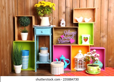 Beautiful Colorful Shelves With Different Home Related Objects On Wooden Wall Background