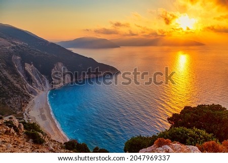 Beautiful colorful sunset at famous Myrtos beach on Kefalonia Isoland. Ionian sea, Greece.