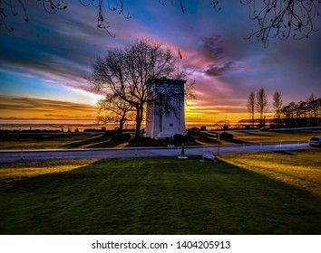 Beautiful Colorful Sunset The Sun Sets Over Trees And The Peace Arch At The Border Crossing