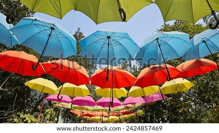 Beautiful colorful umbrellas as a decoration of the road of a campus in Bangladesh.