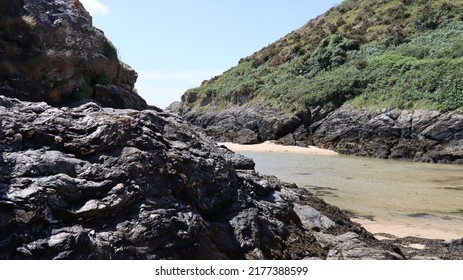 The beautiful colors and the black rocks at the beach in Brittany on the island Belle Ile in the French department of Morbihan