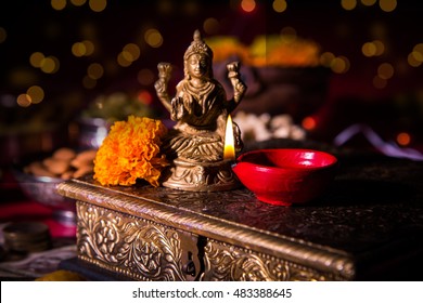 Beautiful Colourful Diya Or Clay Oil Lamp Lit  With Statue Of Goddess Laxmi On Lakshmi Pujan Or Pooja In Diwali Or Deepawali, A Festival Of Light