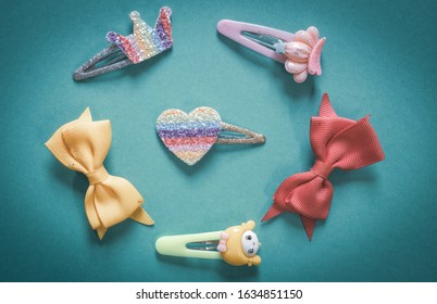 Beautiful And Colourful Hair Clips For Kids And Teens On A Plainbackground.