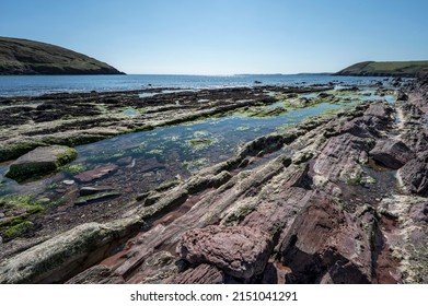 Beautiful Colourful Rock Pools On Manorbier Beach In Pembrokshire South Wales