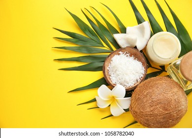 Beautiful composition with coconut oil and nuts on color background
