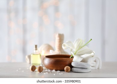 Beautiful composition of spa treatment on wooden table - Shutterstock ID 335980901