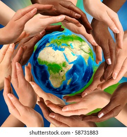 Beautiful Conceptual Symbol Of The Earth Globe With Multiracial Human Hands Around It. Unity And World Peace Concept.