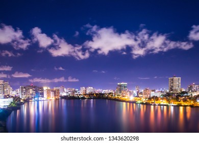  Beautiful Condado Beach, San Juan Puerto Rico Seen At Night With Bay, Buildings And Lights