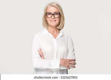 Beautiful Confident Mature Middle Aged Businesswoman In Glasses Looking At Camera Posing Isolated On White Grey Studio Background, Smiling Older Senior Female Professional Lawyer Business Portrait