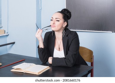 Beautiful Confident Teacher In A Classroom. 