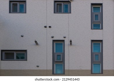 The beautiful construction of several window frames on the wall of the house