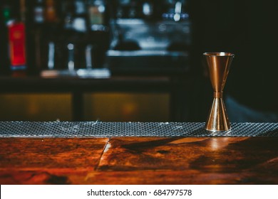 Beautiful Copper Jigger On Wooden Bar Table