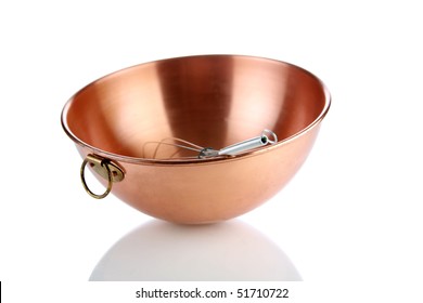 a beautiful copper mixing bowl with a whisk in it on white with nice reflections