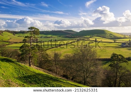 Beautiful countryside and magnificent views of the Somerset countryside from the ramparts of Cadbury hillfort south west England UK