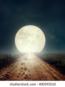 Beautiful countryside road with Milky Way star in night skies, full moon - Retro style artwork with vintage color tone(Elements of this moon image furnished by NASA)