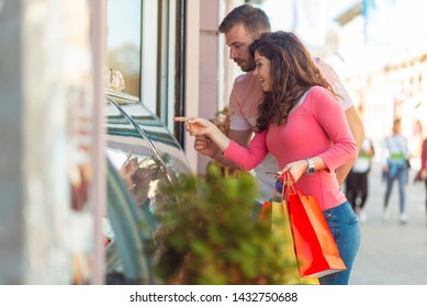 Beautiful Couple Buying Ice Cream In Ice Cream Shop