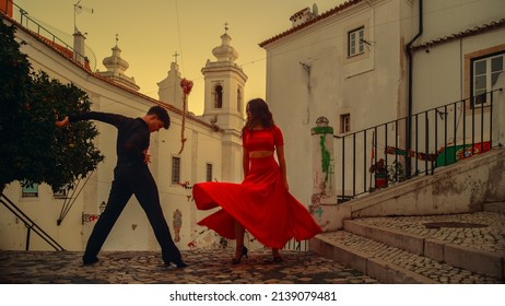 Beautiful Couple Dancing A Latin Dance On The Quiet Street Of An Old Town In A City. Sensual Dance By Two Professional Dancers On A Sunny Day Outside In Ancient Culturally Rich Tourist Location.