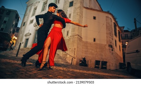 Beautiful Couple Dancing A Latin Dance On The Quiet Street Of An Old Town In A City. Sensual Dance By Two Professional Dancers In The Evening In Ancient Culturally Rich Tourist Location.